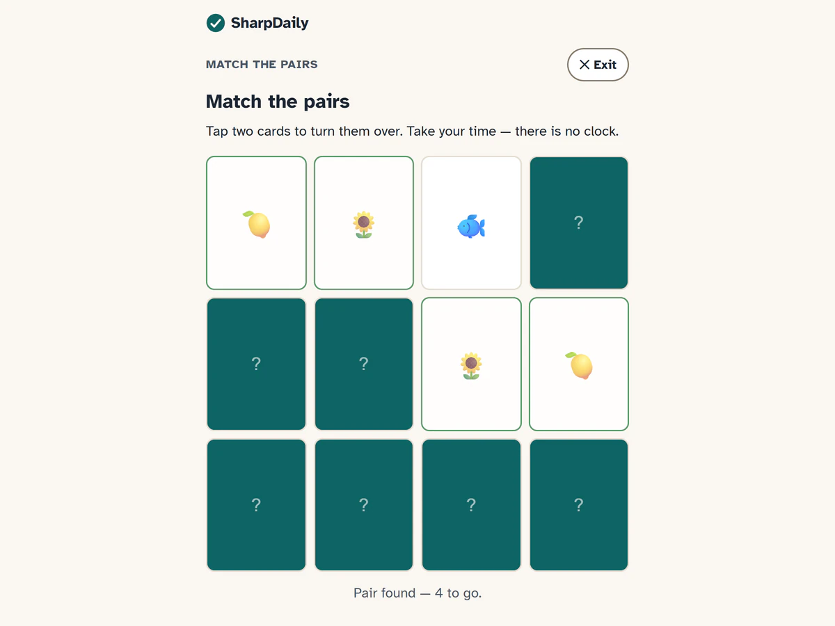 Match the Pairs at Level 2: 12 cards in a 4-by-3 grid, two pairs found (lemons and sunflowers), a fish card turned over, and the line Pair found, 4 to go